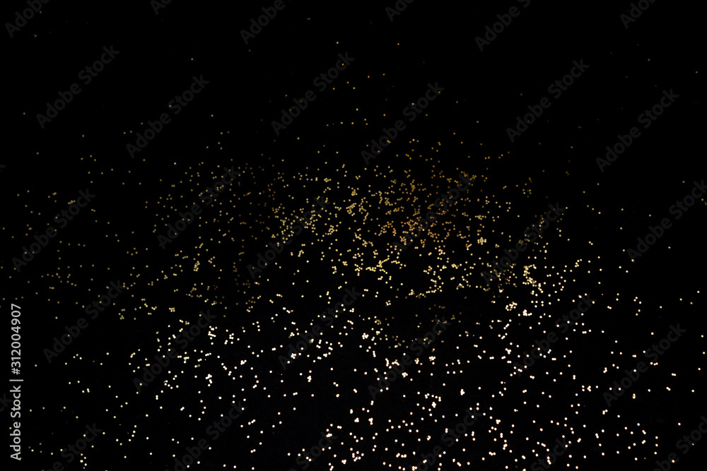 Golden shiny background of sparkles.