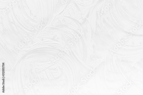 White rough dry plaster texture with curly curved lines as simple abstract background.