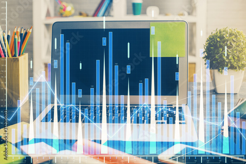 Double exposure of forex chart and work space with computer. Concept of international online trading.