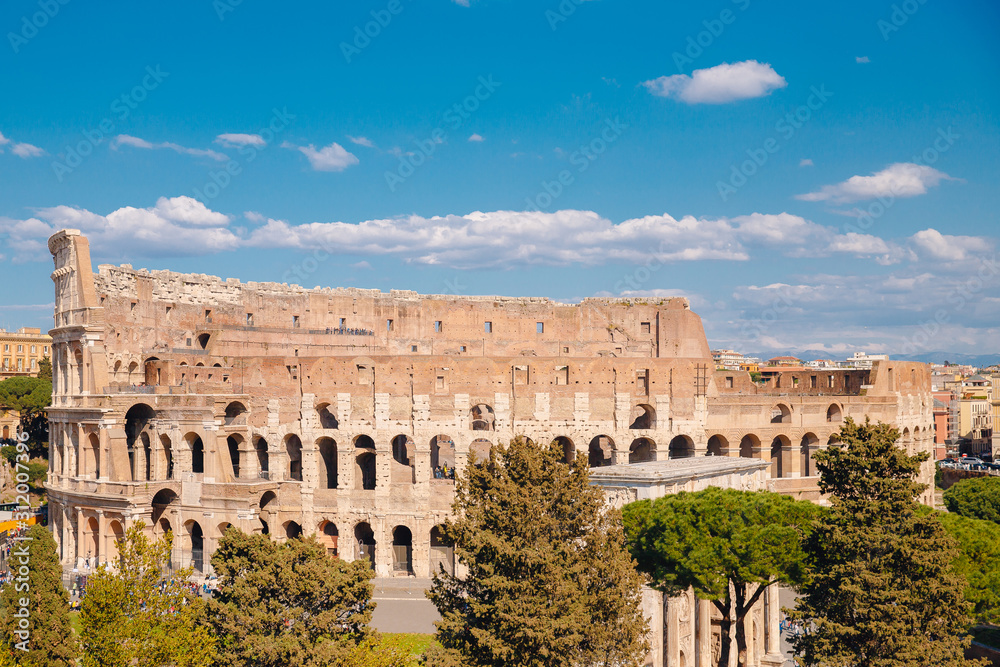 City panorama Rome, Italy Colosseum or Coliseum ancient ruins background blue sky stone arches and sunset