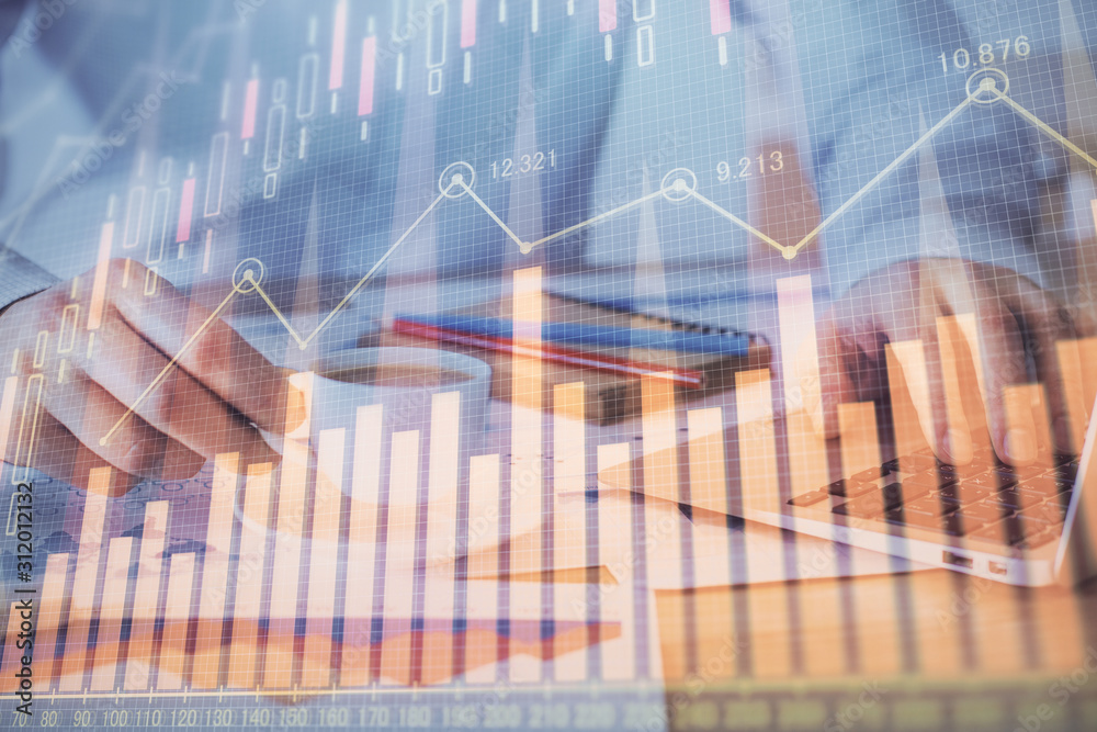 Forex graph with businessman working on computer in office on background. Concept of hardworking. Double exposure. Forex graph with businessman working on computer in office on background. Concept of hardworking. Double exposure.