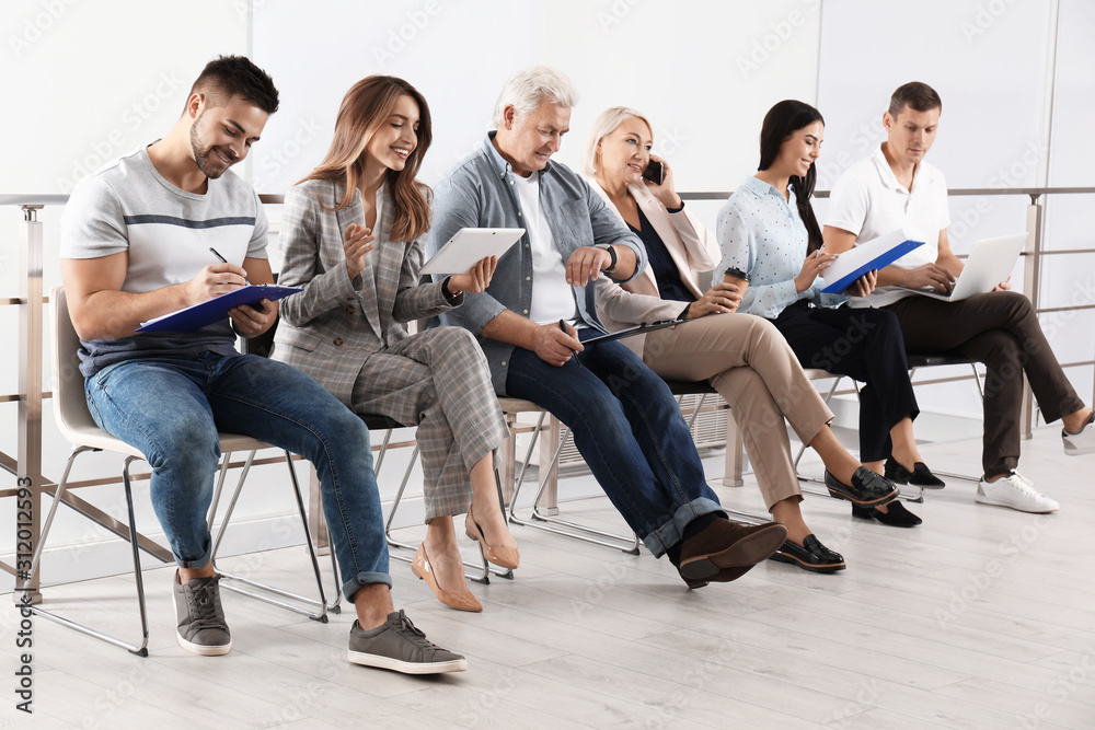 People waiting for job interview in office