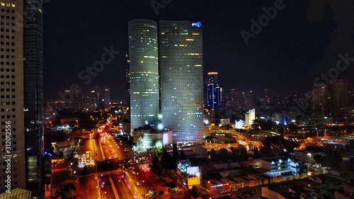 Aerial view on Tel-Aviv. Urban night city never stops. Luxury building and tall towers © GotovyyStock