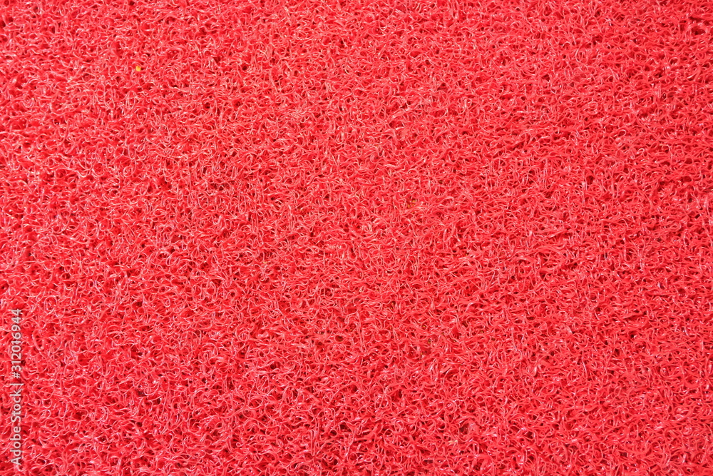 Fototapeta premium Red background plastic fiber parts,close up top view.