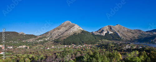 mountain low stone mountains and green valley panorama of Montenegro.