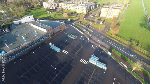 Jib down of large empty parking lot in front of supermarket photo