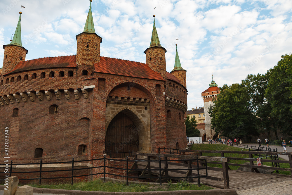 Fototapeta premium KRAKOW, POLAND - MAY 11, 2018: Military building - Barbican gate and fortress