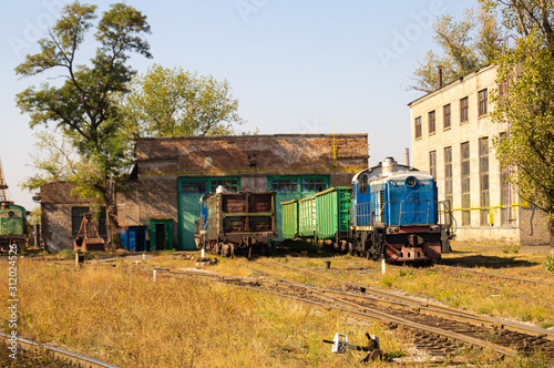 Old diesel locomotive in a depot. Production and transportation. Railway and trains.