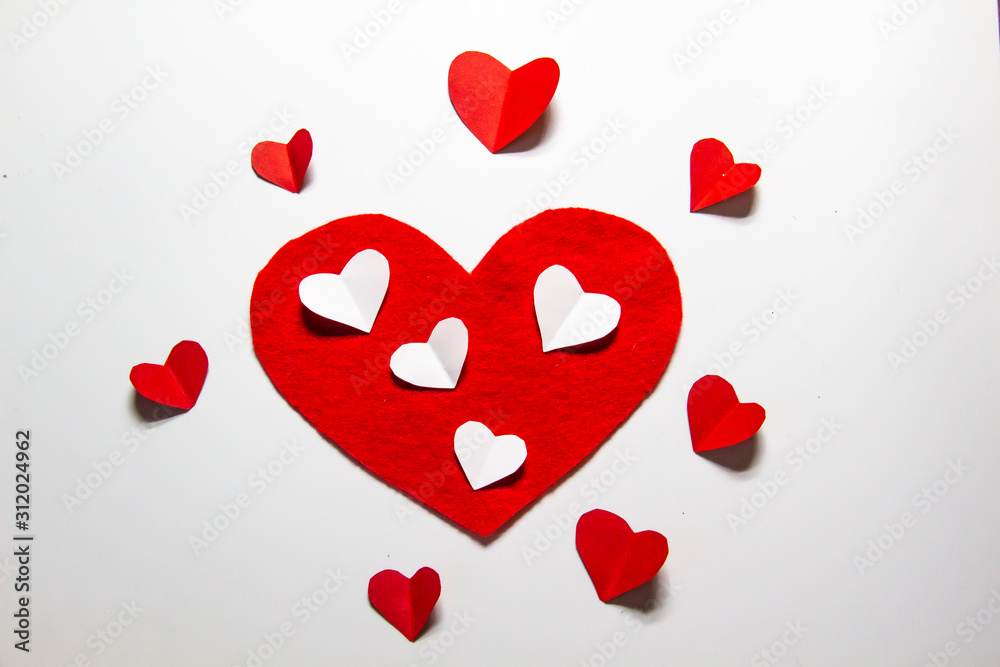A big red heart with many hearts.  A composition with hearts for valentines day. Lovely hearts isolated on background