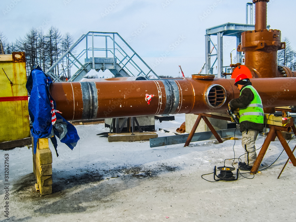 Safety at work. Welding and installation of the pipeline. Indust Safety at work. Welding and installation of the pipeline. Indust