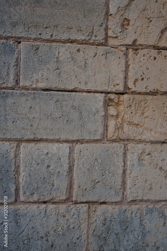 Vintage grunge stone blocks wall texture.