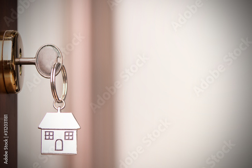 House key in the door. Close up photo