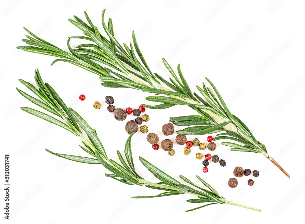 Fresh twigs of rosemary with red and black pepper isolated on a white background