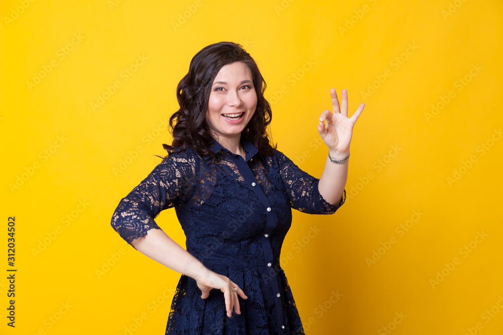 Portrait of a beautiful fashionable Asian woman in a stylish blue dress