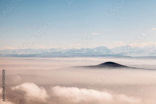 birds eye view of the mountains in the clouds