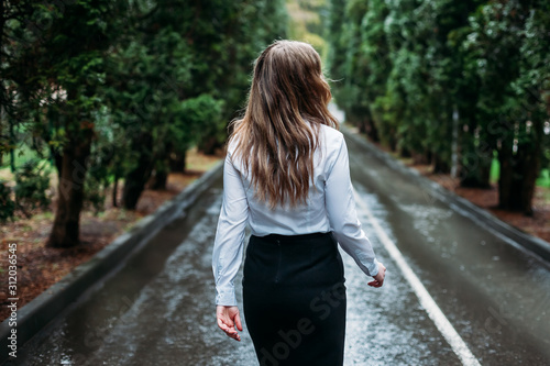 young woman proudly away. the view from the back. outdoors © slayer87