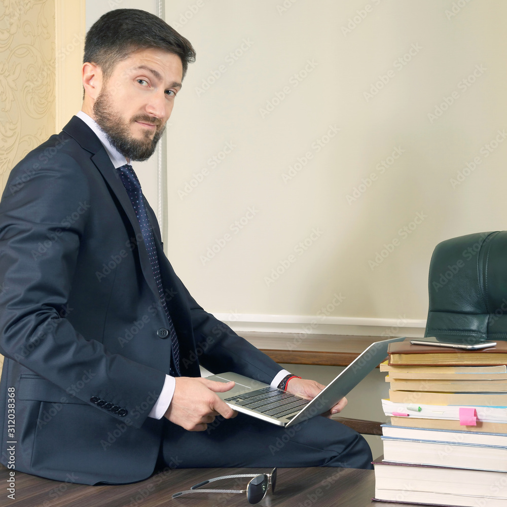 successful business man sitting at office table and working with laptop successful business man sitting at office table and working with laptop