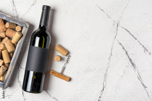 Wine bottle with mock-up label and corkscrew with corks