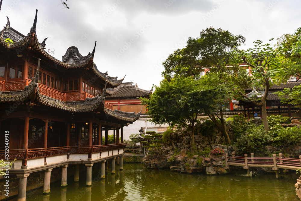 Beautiful, traditional buildings by the water in Yu Garden, Shanghai, China