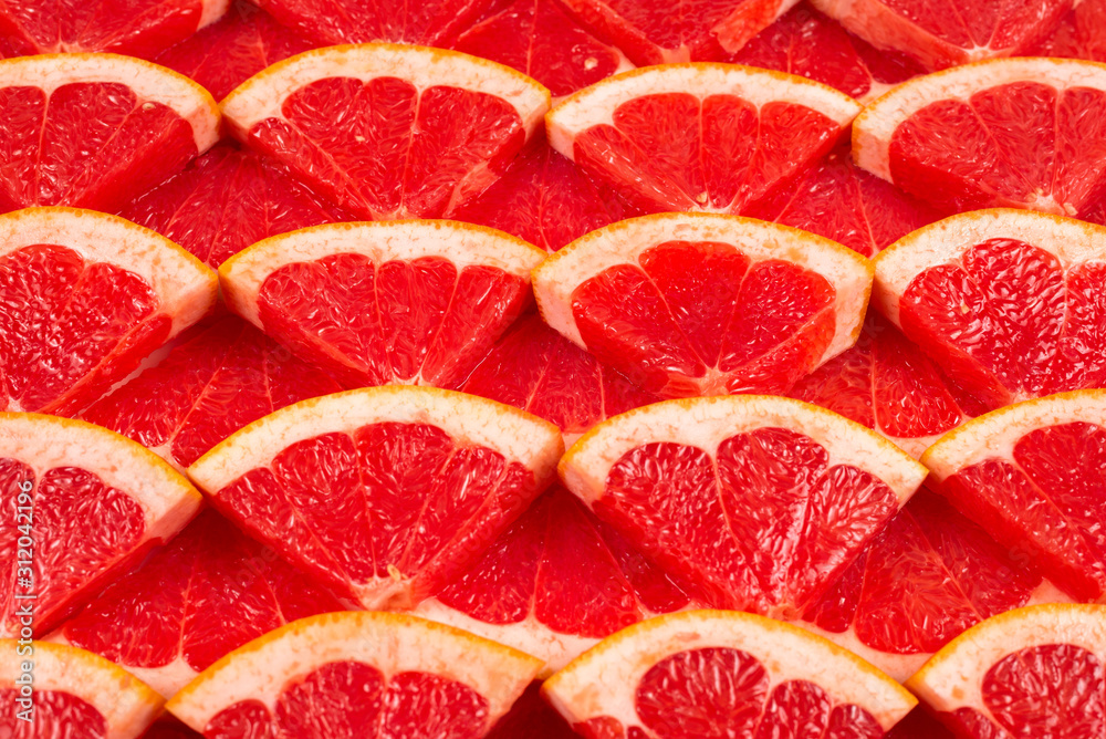 Grapefruit red juicy slices background. top view. Grapefruit red juicy slices background. top view.