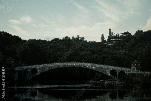 lake bridge and ancient pagoda