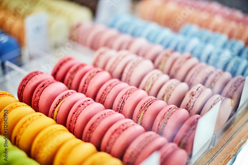 Showcase of rows of french macaroons. Close up of macaroon cookies