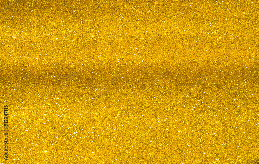 sparkles of golden glitter texture background