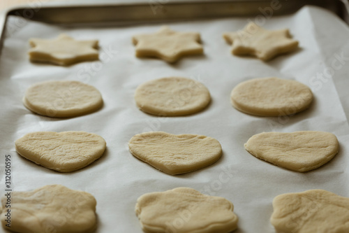 Homemade cookies on a tray ready to be baked.