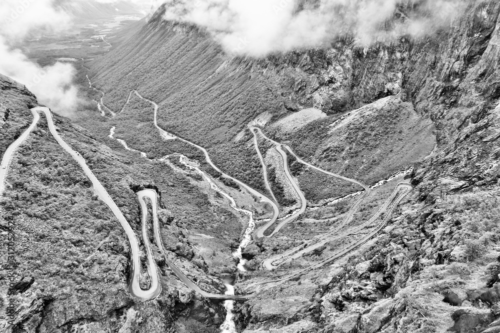 Naklejka premium Troll Road, Norway. Black and white vintage toned.