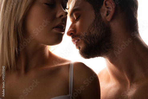 close up of attractive woman and sensual man, isolated on white
