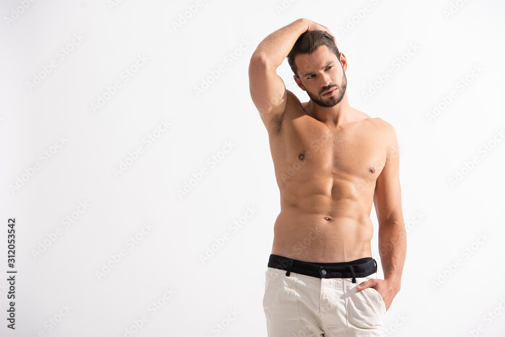 handsome shirtless man in white jeans, isolated on white
