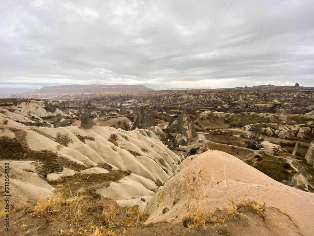 Ancient rock formations with caves. A famous place for flying in balloons. Cappadocia. Turkey November 5, 2019.