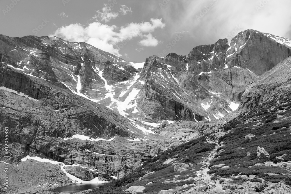 Rocky Mountains trail. Vintage filtered black and white tone.