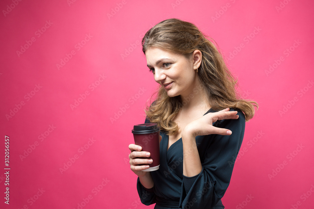 Glamor woman with a drink of coffee on a pink background Glamor woman with a drink of coffee on a pink background
