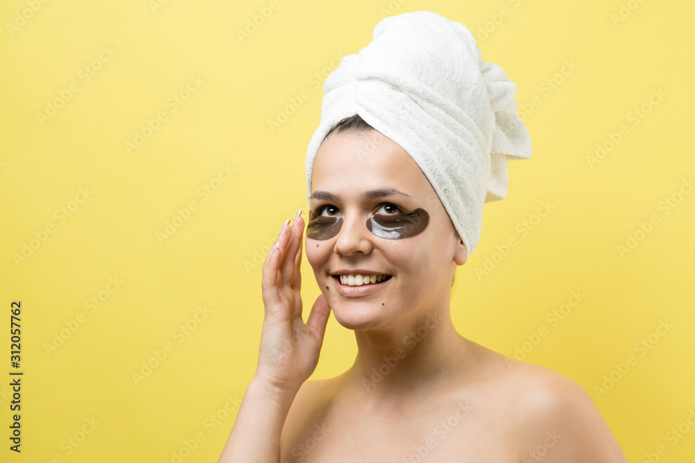 © Mountains Hunter - Young beautiful girl in a white towel on his head wears collagen gel patches under her eyes. Mask under eyes treatment face. © Mountains Hunter - Young beautiful girl in a white towel on his head wears collagen gel patches under her eyes. Mask under eyes treatment face.