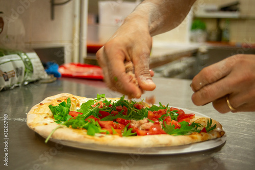 Fototapeta Naklejka Na Ścianę i Meble -  preparing pizza