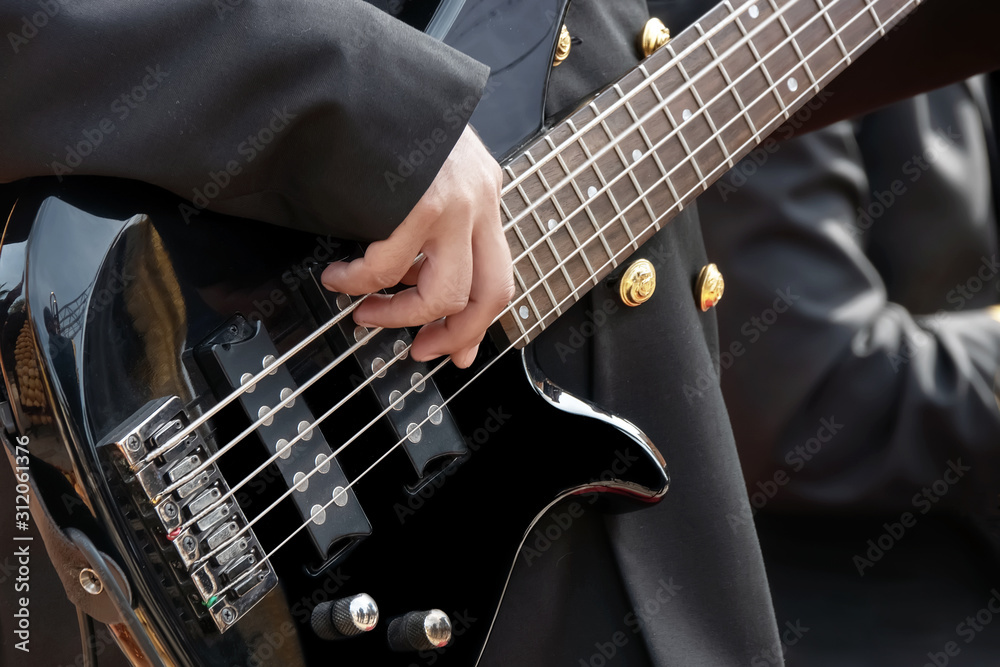 Fototapeta premium bass guitar player and details