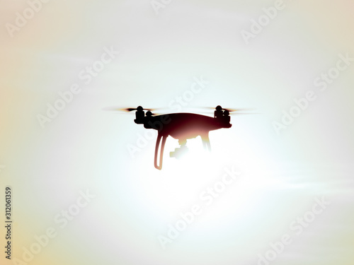 Quadrocopters silhouette against the background of the sunset