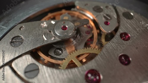 Wallpaper Mural The gears of the working mechanical watches are stopped with a wooden stick. Macro Slow motion Torontodigital.ca