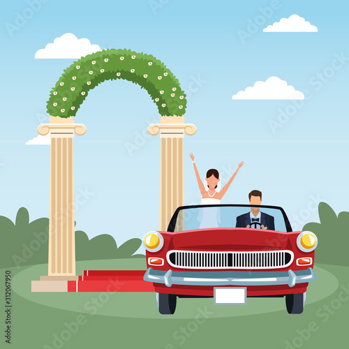Red classic car with Just married couple over floral arch and landscape background