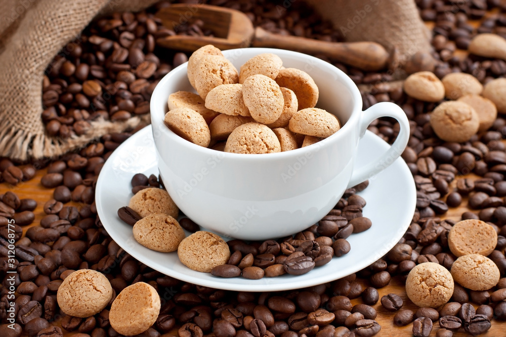 Composition with coffee cup with tasty almond cookies Composition with coffee cup with tasty almond cookies