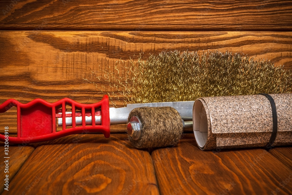 Set of abrasive tools and sandpaper on vintage wooden boards