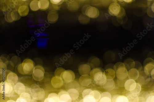 Abstract Bokeh background of defocused glittering lights. Christmas, Party, New Year, luxurious background pattern concept. banner