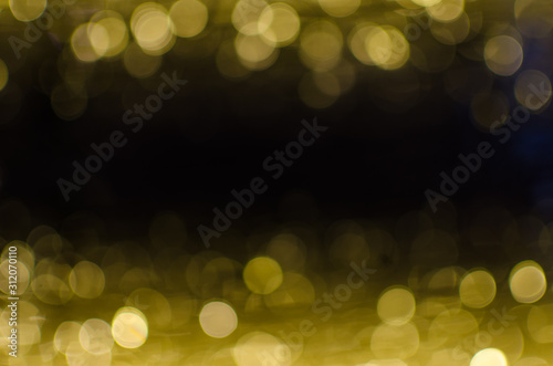 Abstract Bokeh background of defocused glittering lights. Christmas, Party, New Year, luxurious background pattern concept. banner