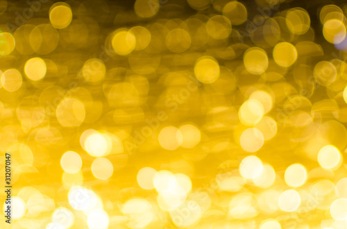 Abstract Bokeh background of defocused glittering lights. Christmas, Party, New Year, luxurious background pattern concept. banner