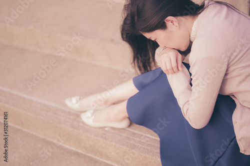 Asian woman sitting alone and depressed,Portrait of tired young woman. Depression