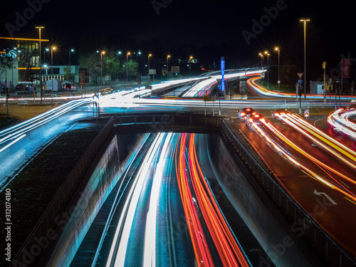 Car traffic at night in neu-ulm, germany photo