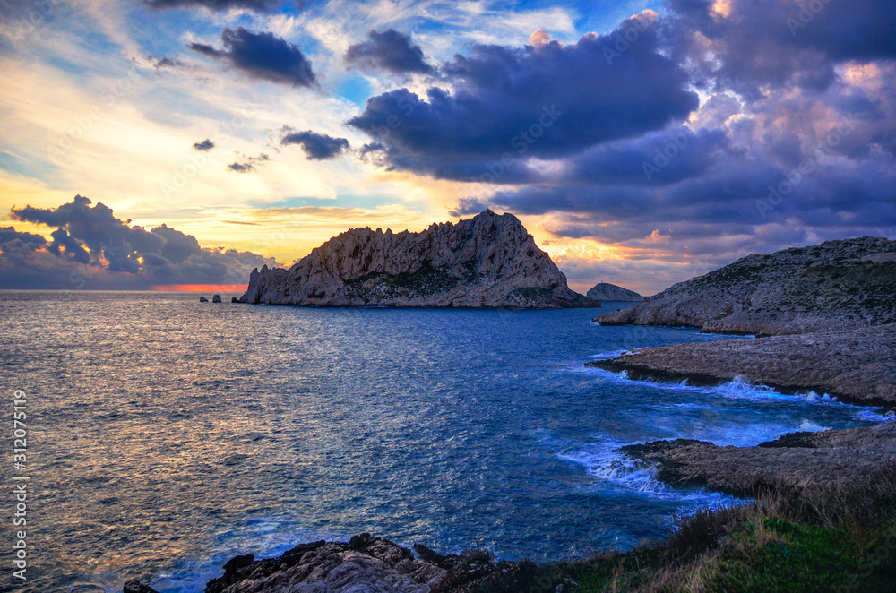 Dramatic shot of Maire Island near Cap Croisette in Marseille Dramatic shot of Maire Island near Cap Croisette in Marseille