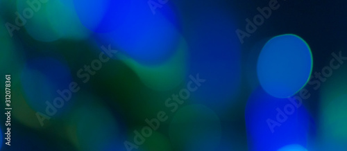 Abstract Bokeh Blue and green background of defocused glittering lights. Christmas, Party, New Year, luxurious background pattern concept. banner.