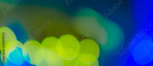 Abstract Bokeh Blue and green background of defocused glittering lights. Christmas, Party, New Year, luxurious background pattern concept. banner.